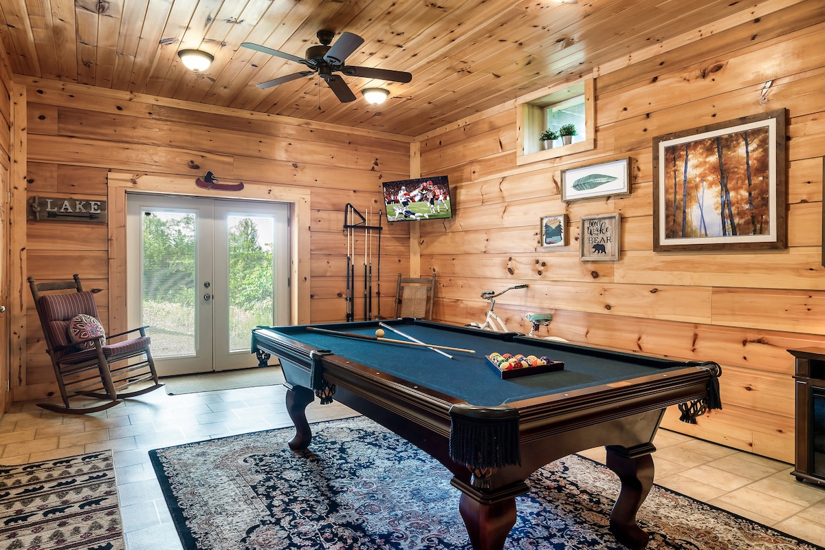 Recreation room with a pool table and timber interior