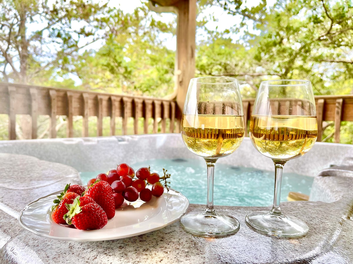 Table setting with wine and strawberries on the cabin's covered porch